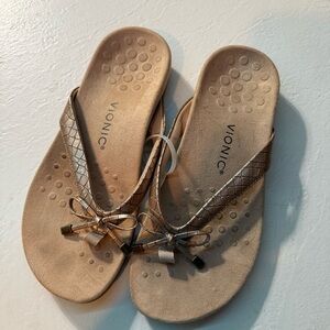 Gold Vionic bow flip flops